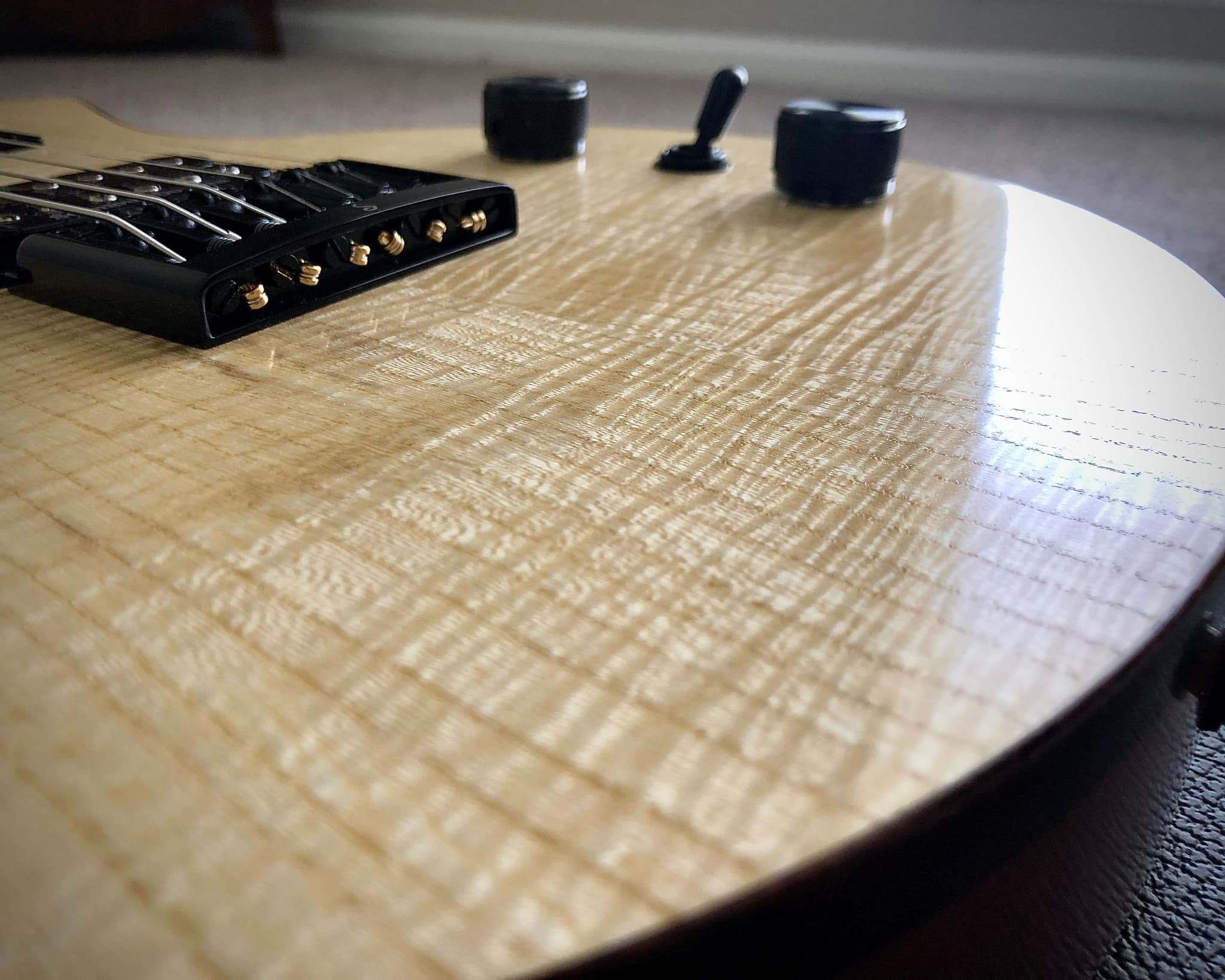Walnut top, maple binding and mahogany back
